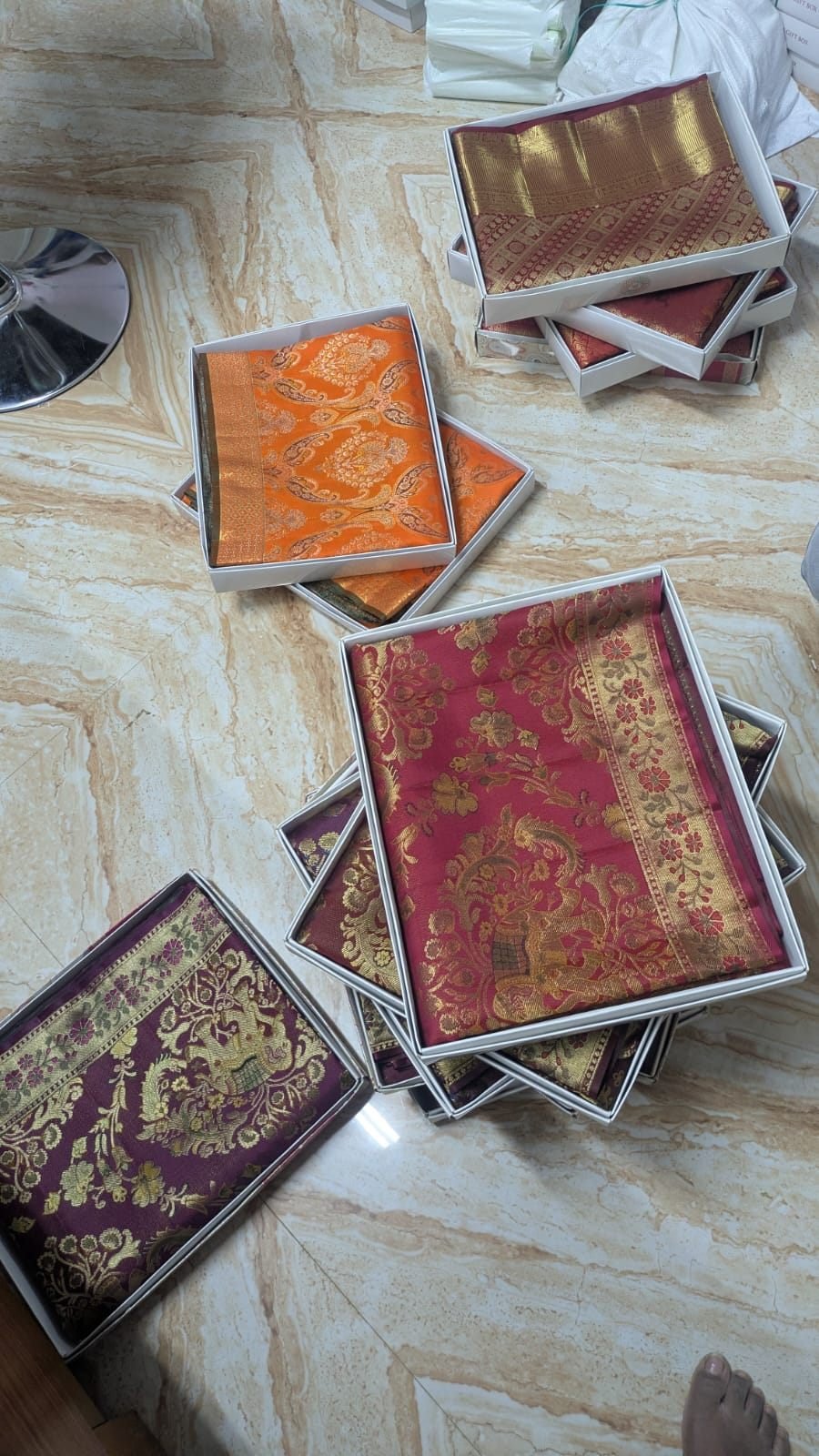 Maroon and gold ornate floral handloom silk sarees in presentation boxes, Ramanji Handlooms Dharmavaram stock