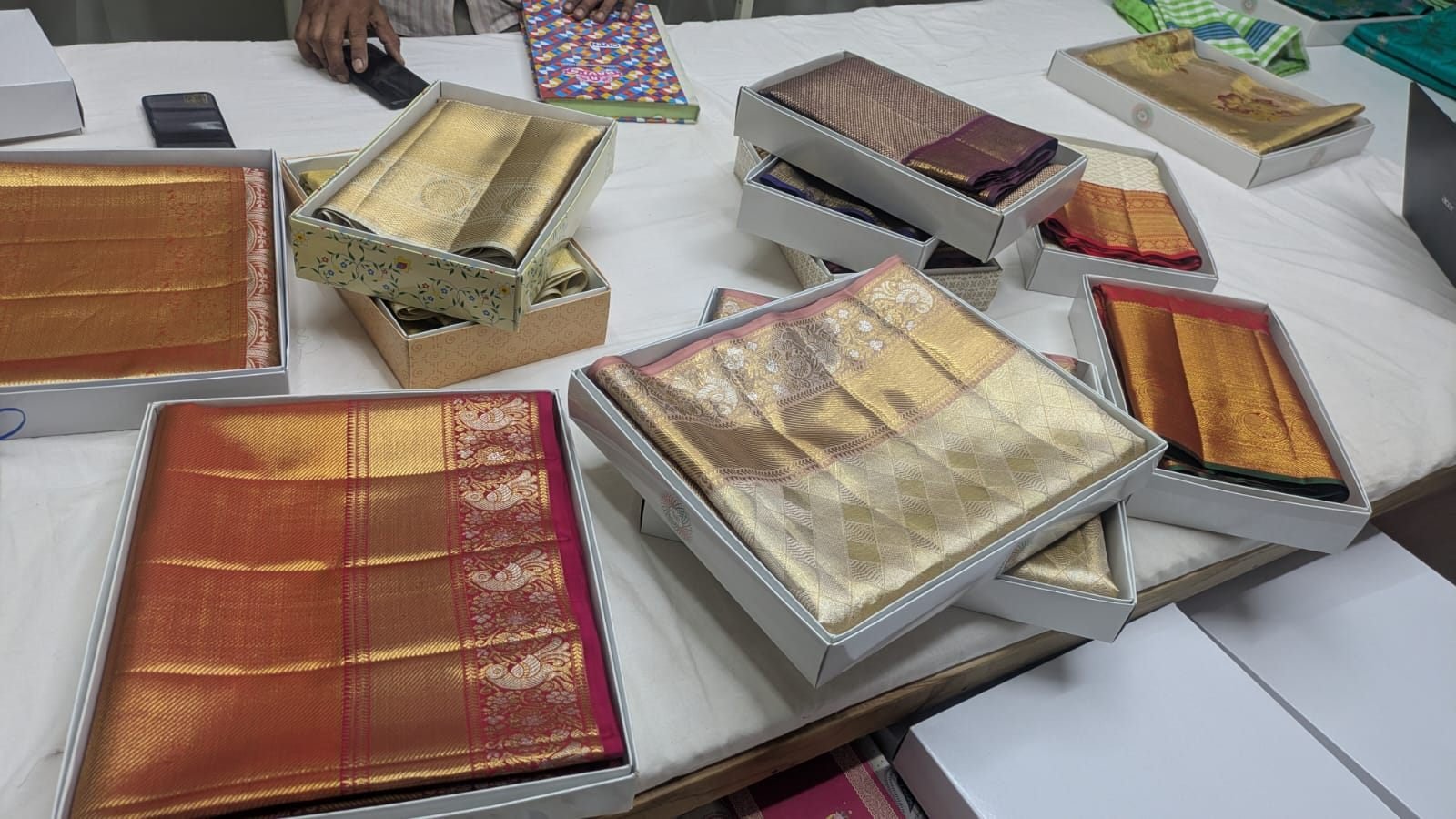 Handloom silk sarees being photographed for the online catalog at Ramanji Handlooms