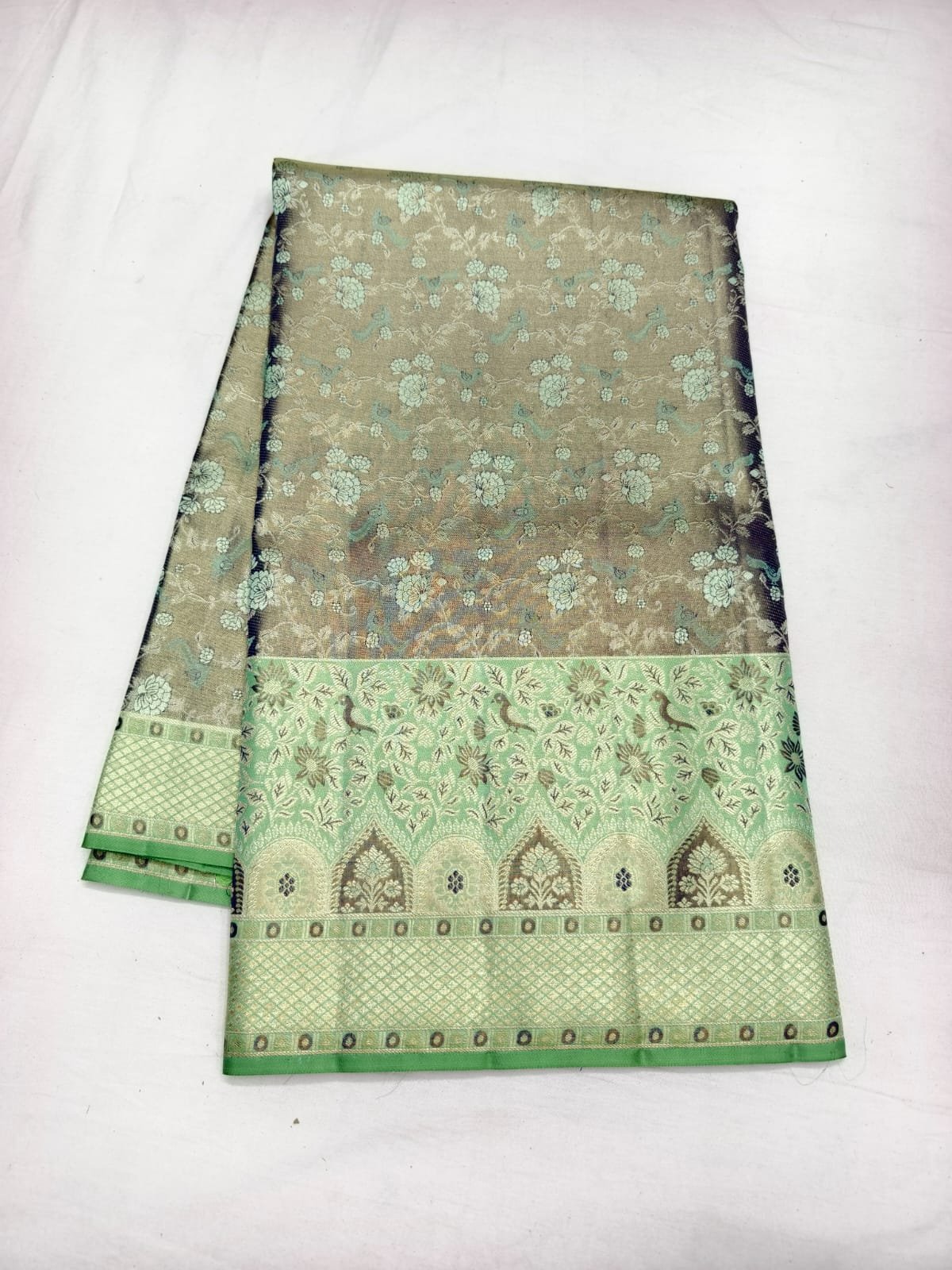 Sage green meenakari silk saree, a wedding guest saree option from Dharmavaram