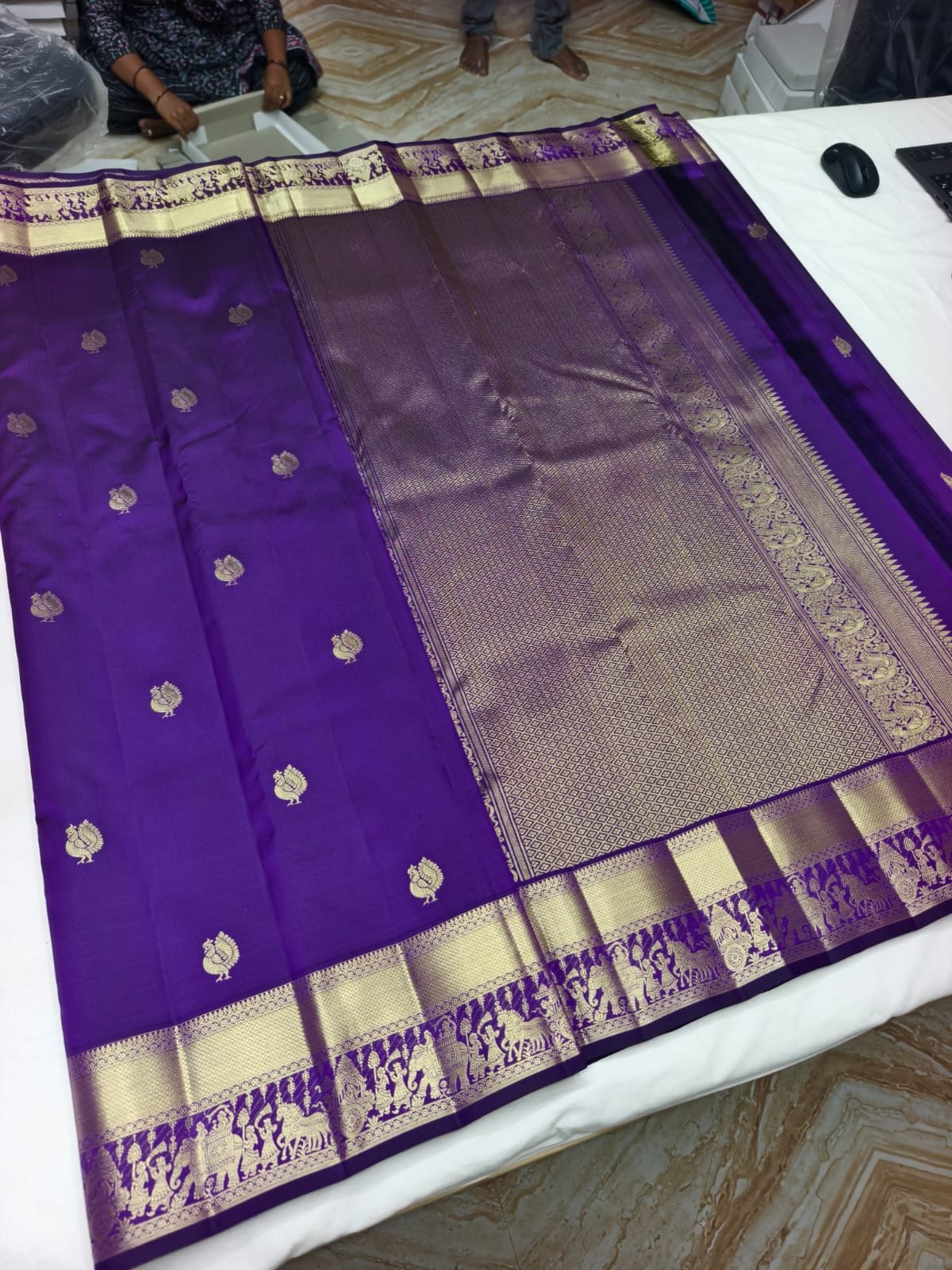 Violet handloom butta saree with bird motif, suitable for wedding guests