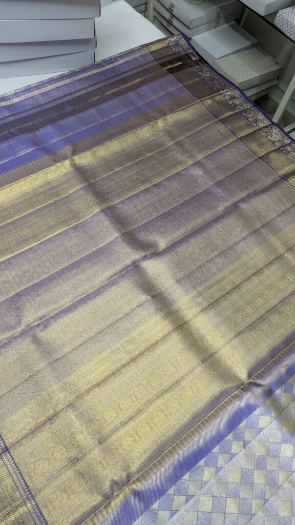 Peacock motif pallu border on a Dharmavaram pattu saree - checking border and pallu quality