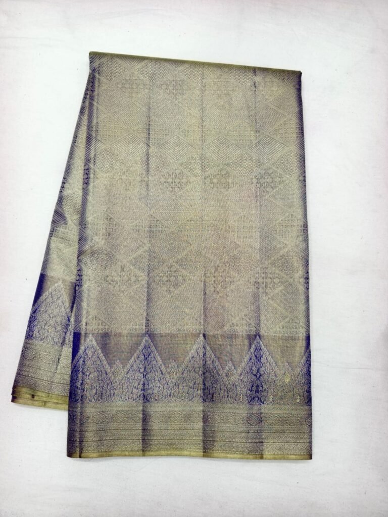 Antique gold Dharmavaram pattu saree with geometric brocade and a navy blue temple triangle pallu