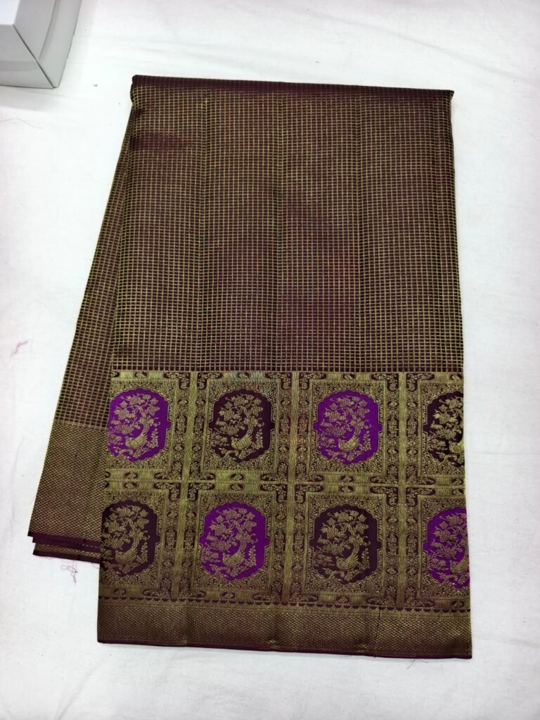 Brown Dharmavaram pattu saree with fine check weave and a gold pallu with purple peacock medallions