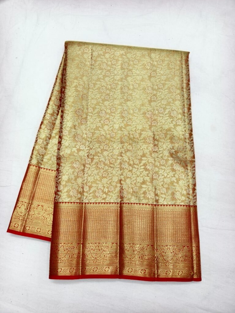 Cream gold Dharmavaram silk saree with all-over floral brocade and a broad red gold zari border