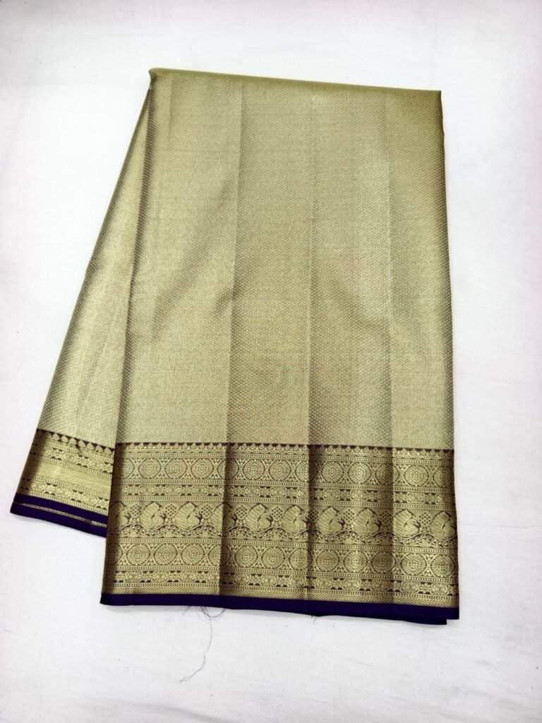 Gold Dharmavaram pattu saree with fine check brocade and a broad navy blue gold zari border