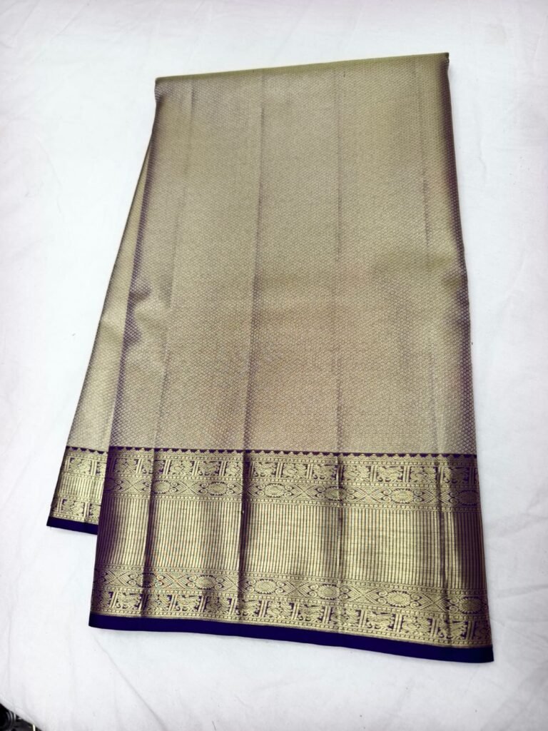 Grey gold Dharmavaram pattu saree with silver gold brocade and a broad navy blue zari border
