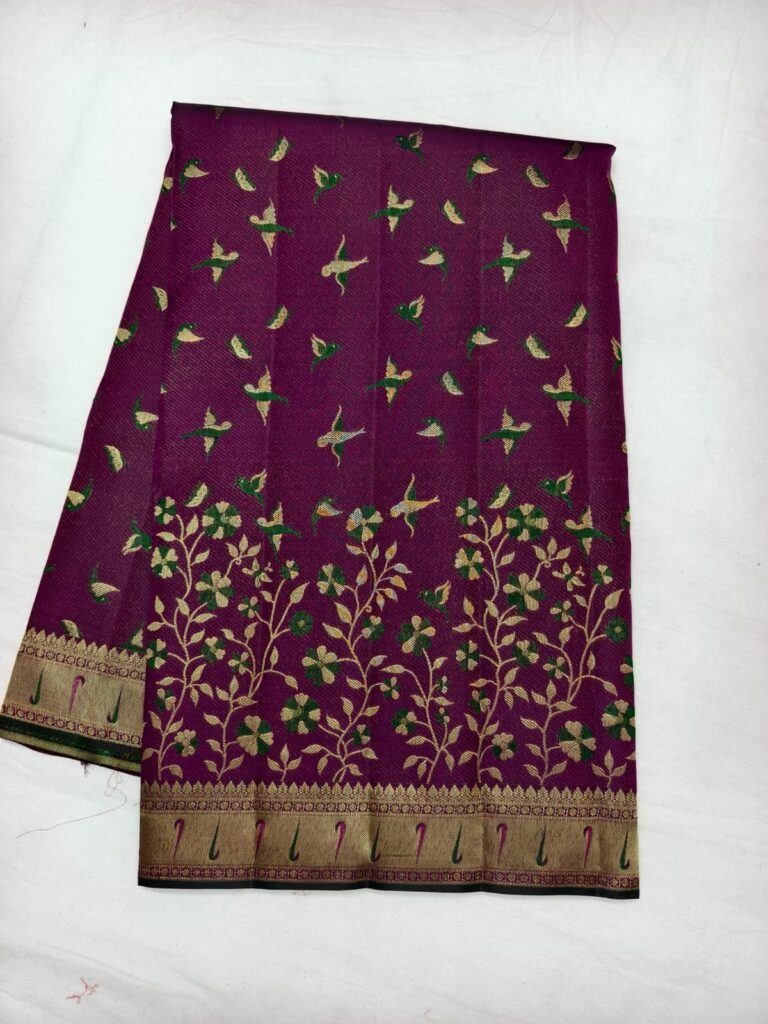 Magenta Dharmavaram parrot design pattu saree with green parrot motifs and a floral creeper pallu