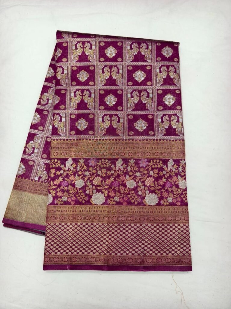 Magenta Dharmavaram pattu saree with peacock pairs woven in grid squares and a floral pallu