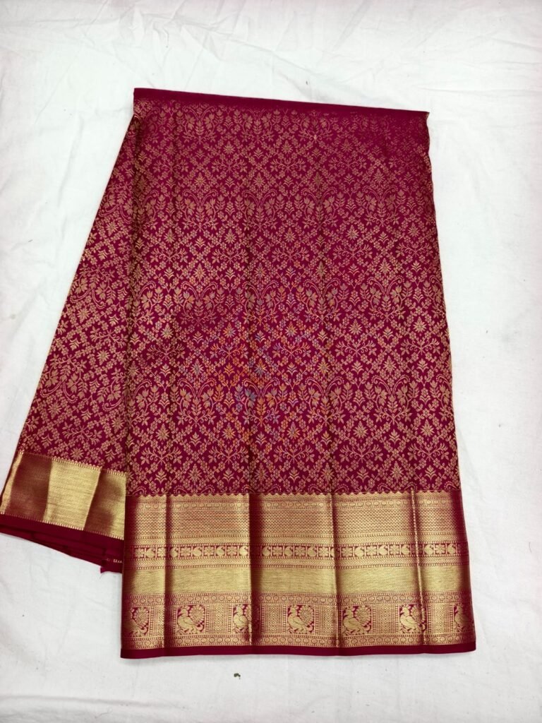 Maroon Dharmavaram silk saree with gold diamond lattice brocade and a broad gold zari border