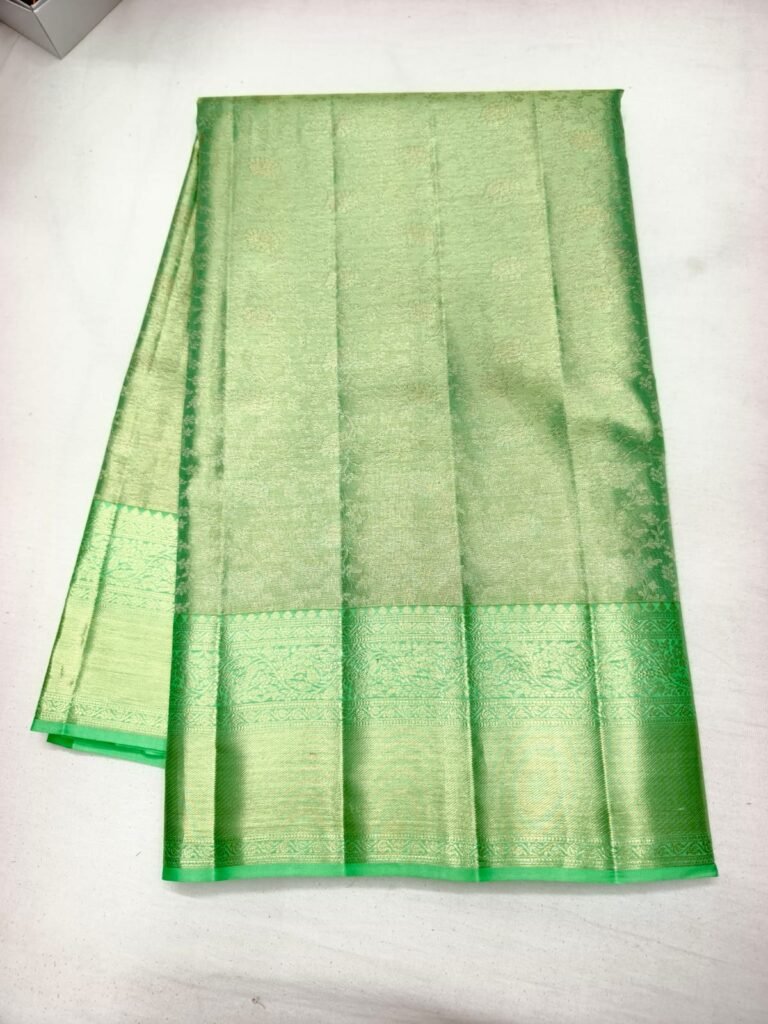 Mint green Dharmavaram handloom saree with gold brocade body and a broad green zari border