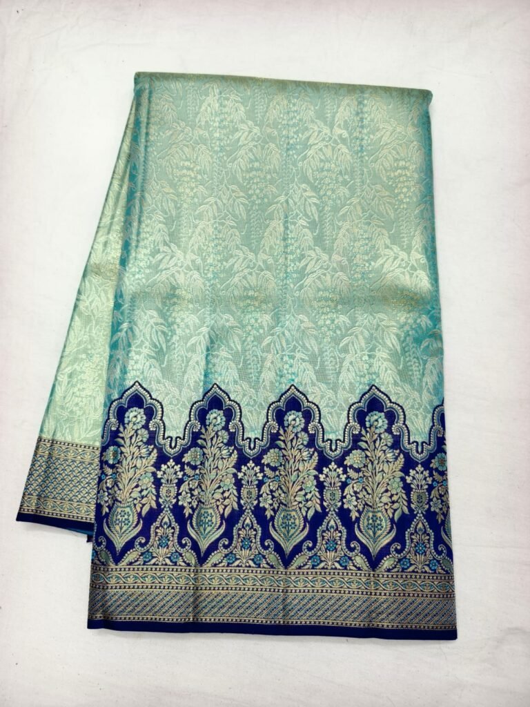 Mint green Dharmavaram silk saree with leaf brocade and a navy blue mughal arch pallu in gold zari
