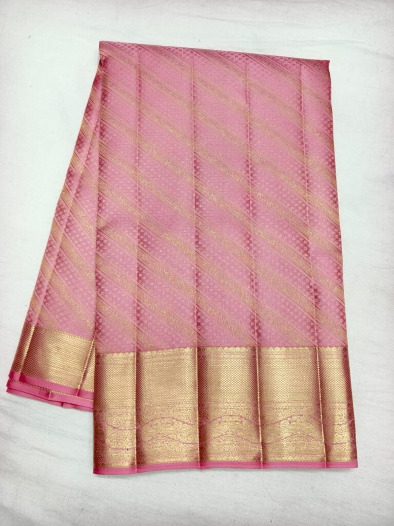 Pink Dharmavaram silk saree with gold diagonal stripe brocade and a broad gold zari border