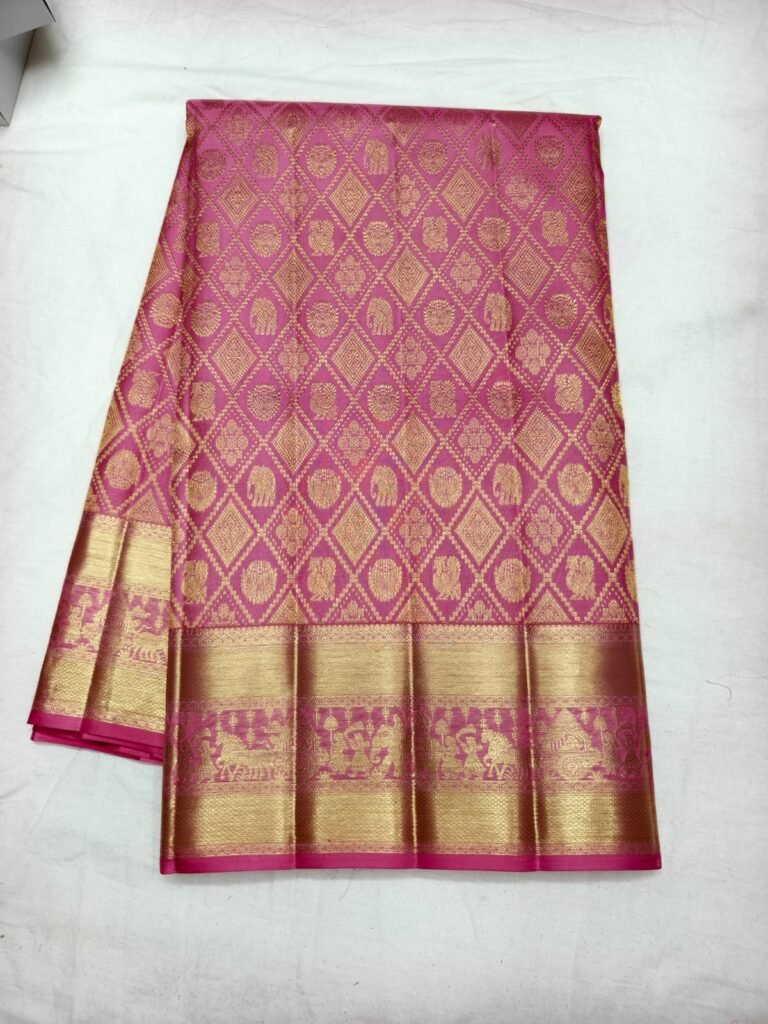 Pink Dharmavaram handloom saree with gold diamond lattice brocade holding elephant motifs