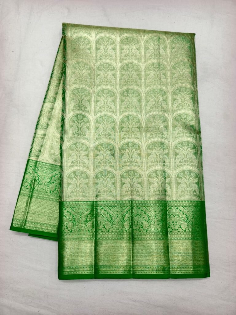 Pista green Dharmavaram silk saree with woven arch and tree motifs and a bright green zari border