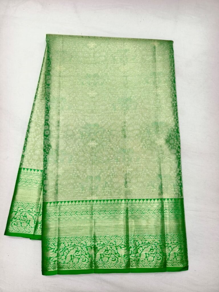 Pista green Dharmavaram handloom pattu saree with fine brocade and a green peacock and elephant border
