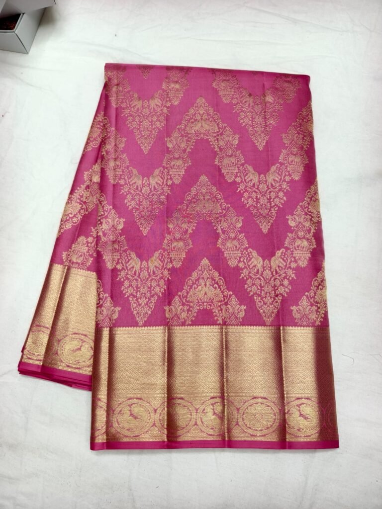 Rani pink Dharmavaram pattu saree with gold chevron damask brocade and a broad gold zari roundel border