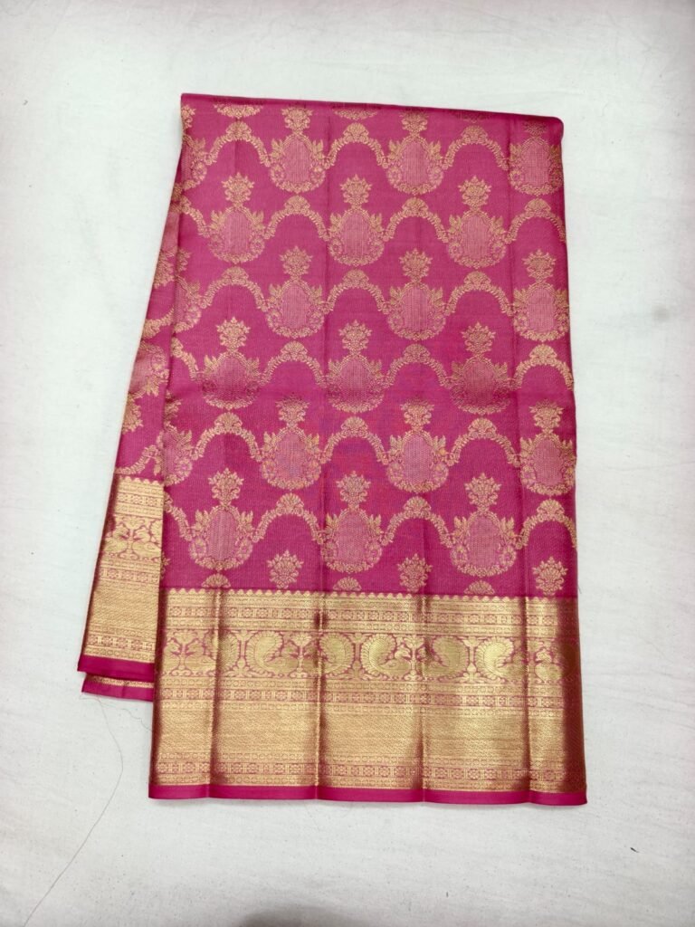 Rani pink Dharmavaram pattu saree with gold kalga damask brocade and a broad gold zari border