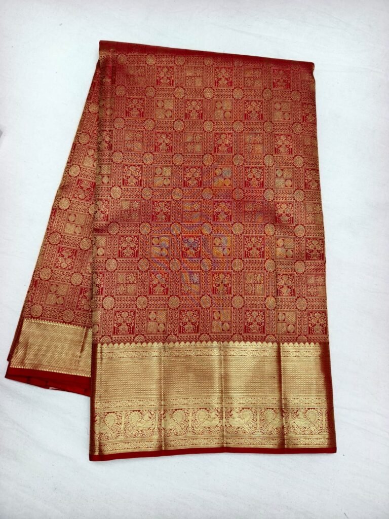 Red Dharmavaram bridal saree with gold square grid brocade and a broad gold zari peacock border