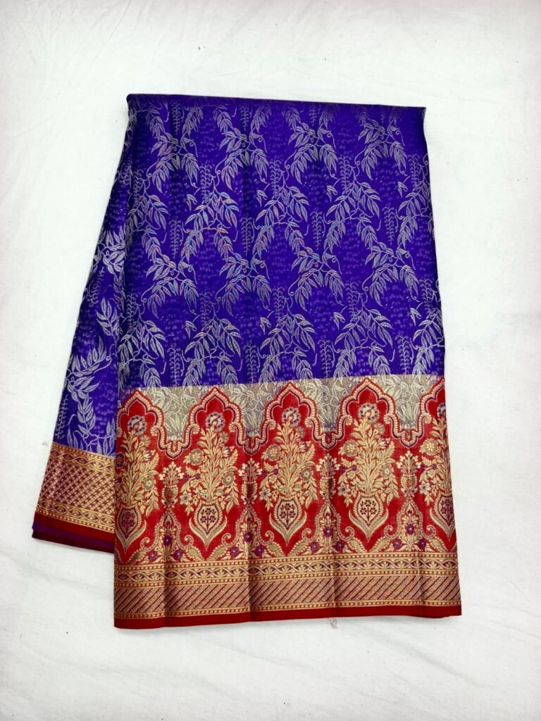 Royal blue Dharmavaram pattu saree with silver leaf vine brocade and a red and gold kalga pallu