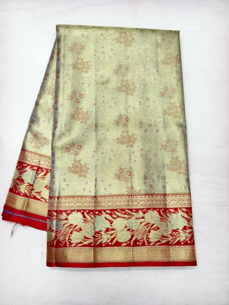 Sage green Dharmavaram butta saree with scattered floral butta and a red gold zari border