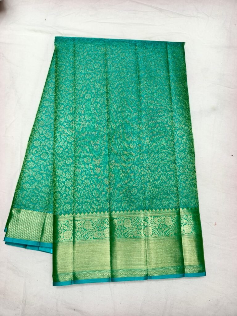 Teal Dharmavaram pattu saree with gold floral jaal brocade and a broad green zari border