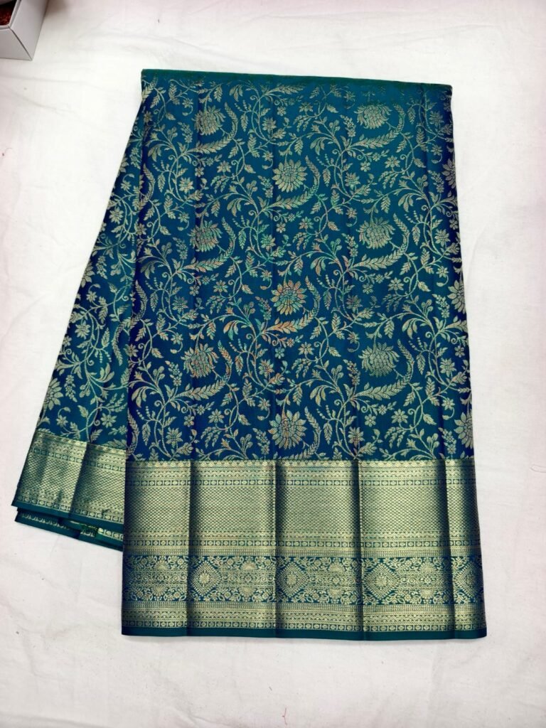 Teal Dharmavaram bridal saree with all over gold floral vine jaal and a broad zari border