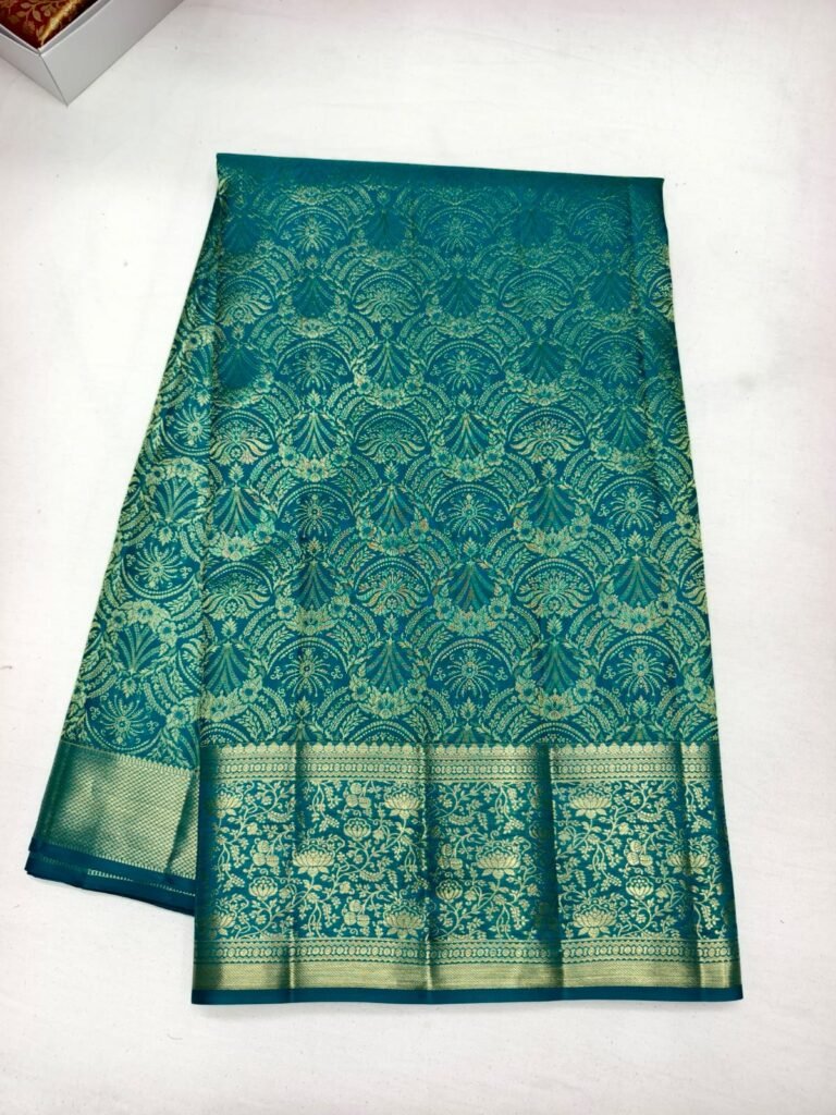 Teal Dharmavaram bridal silk saree with all over gold paisley damask brocade and a floral zari pallu