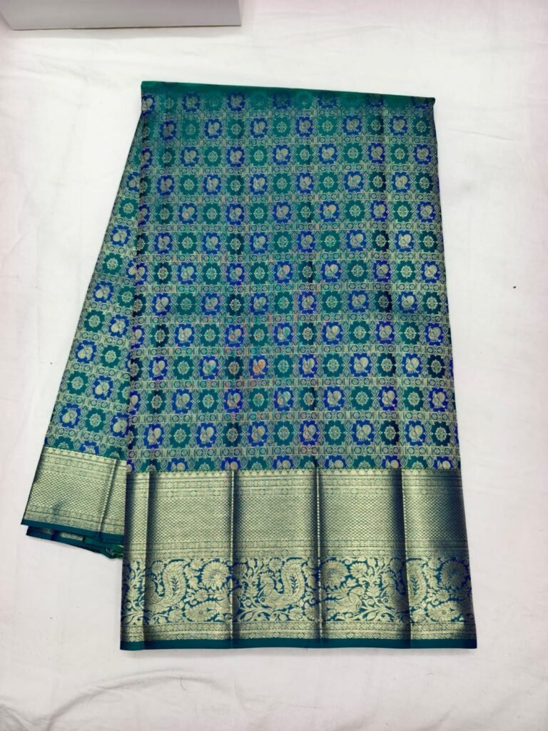 Teal Dharmavaram handloom pattu saree with blue and gold square grid brocade and a silver gold border