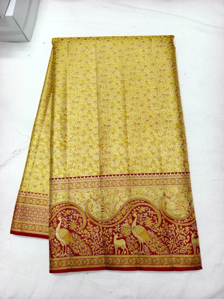 Yellow Dharmavaram butta saree with small floral butti and a maroon border woven with peacocks and deer